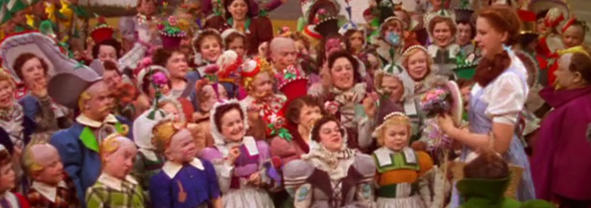 Judy Garland (Dorothy) and the Munchkins